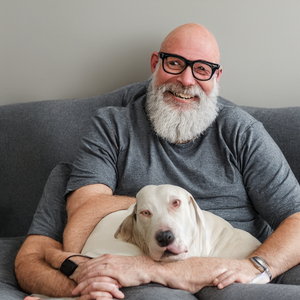 Distorted bald white man with six arms, way too many figures, and a distorted dog